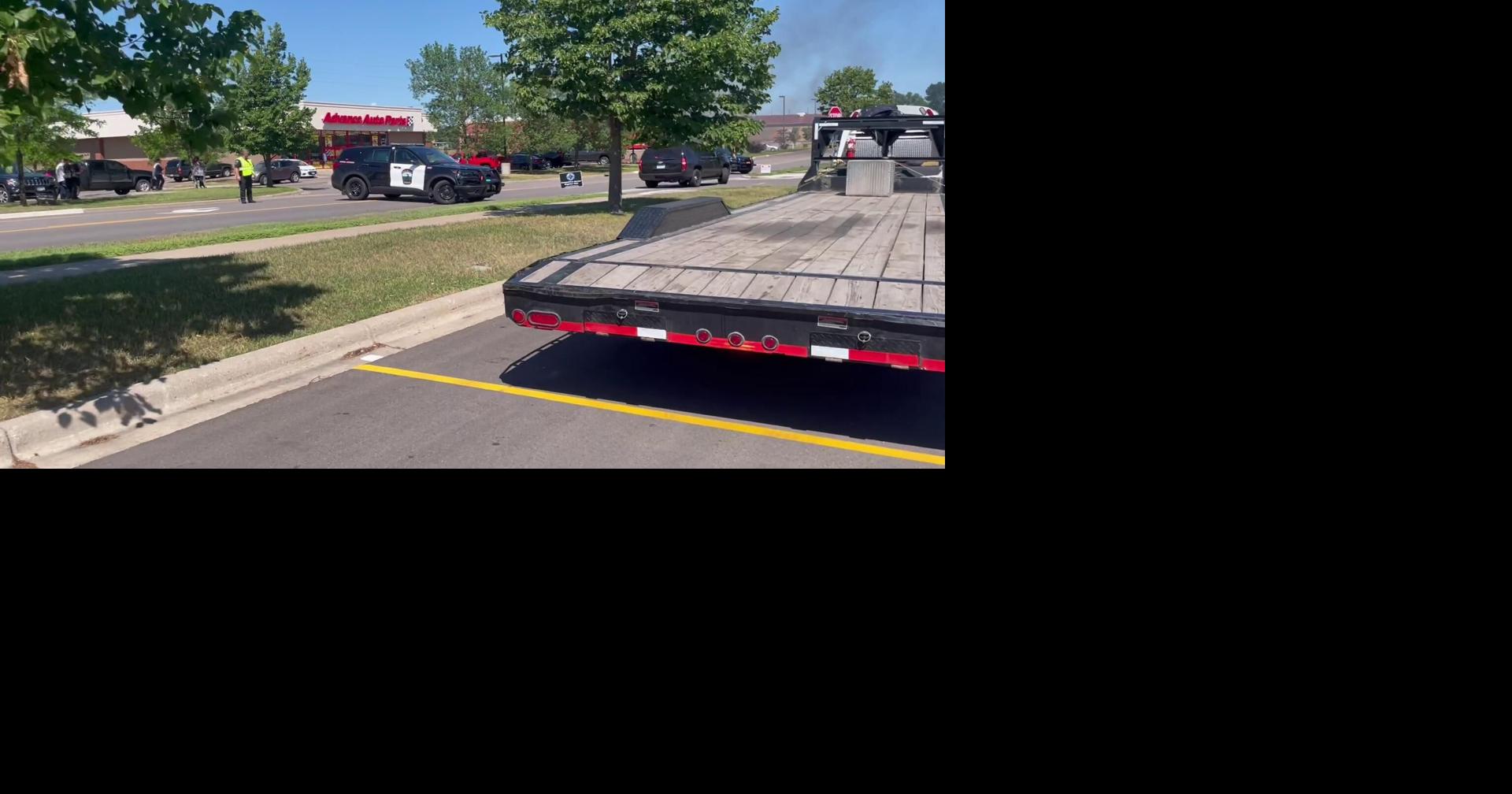 Sign on front of Elk River Auto Zone storefront catches fire