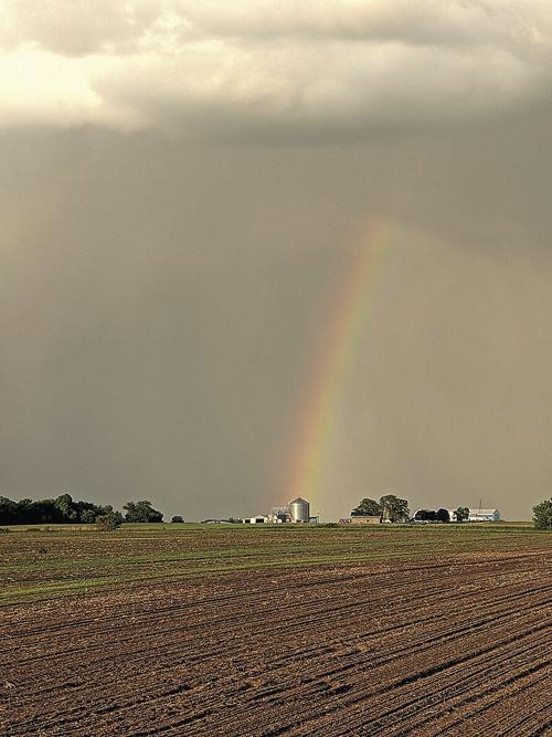 Rainbow over grain bin
