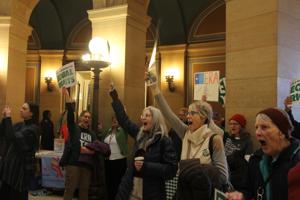Other Text Supporters chant in support of an Equal Rights Amendment in the Capitol rotunda March 12 in St. Paul, where advocates urged lawmakers to put the proposed constitutional amendment before voters. Alt Text