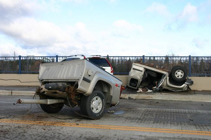 One airlifted, truck ripped in two after morning crash