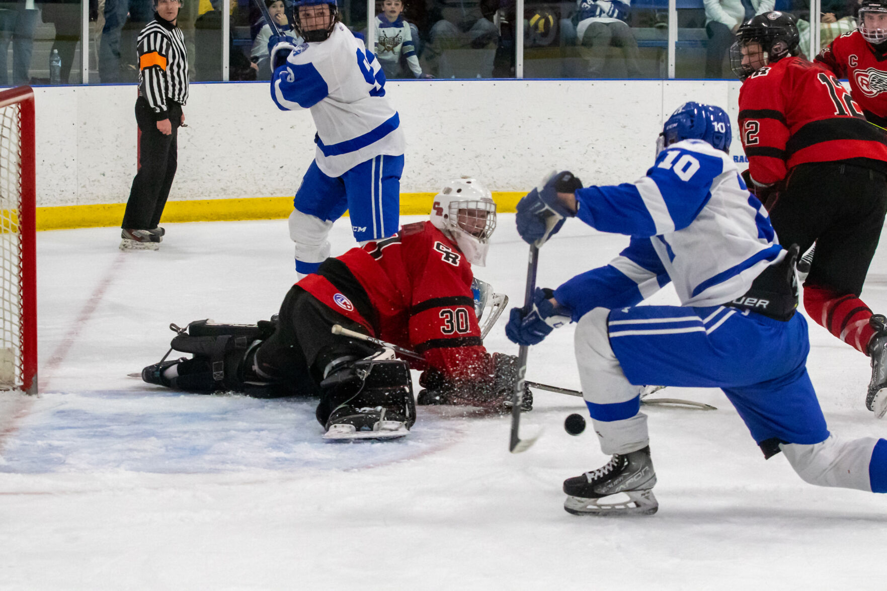 Rogers boys hockey defeats Coon Rapids in section quarterfinals
