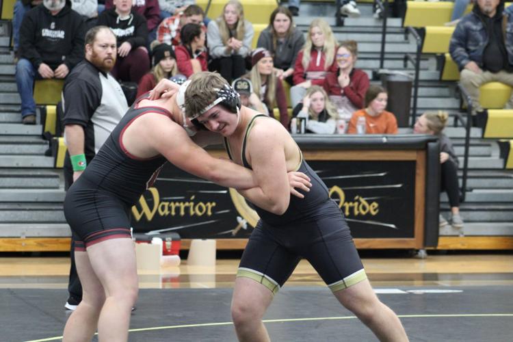 Warriors wrestling prevails at home against Decorah and Chatfield
