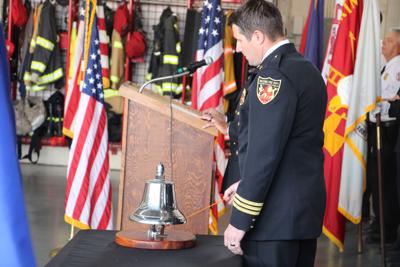 Justin Sorensen rings bell at 911 ceremony.JPG