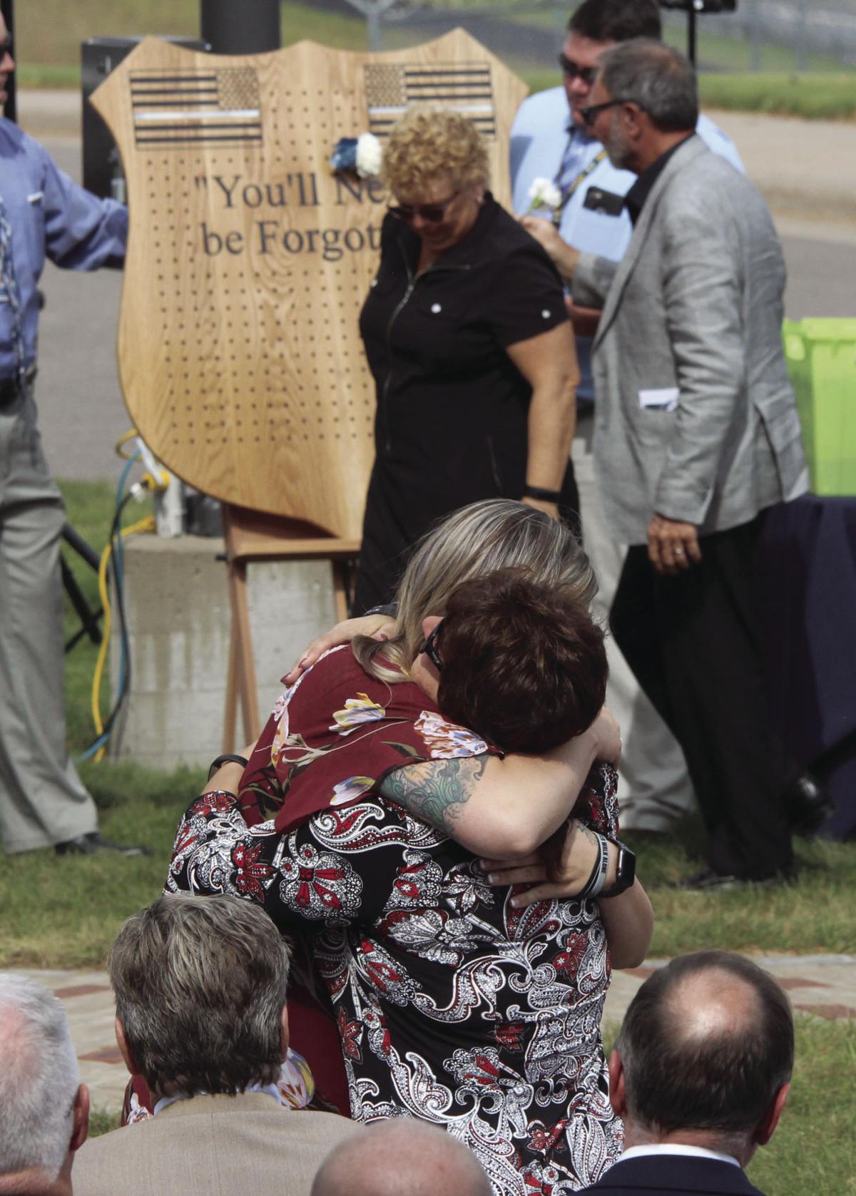 Parise Andrea and Michelle Smith hug.jpg