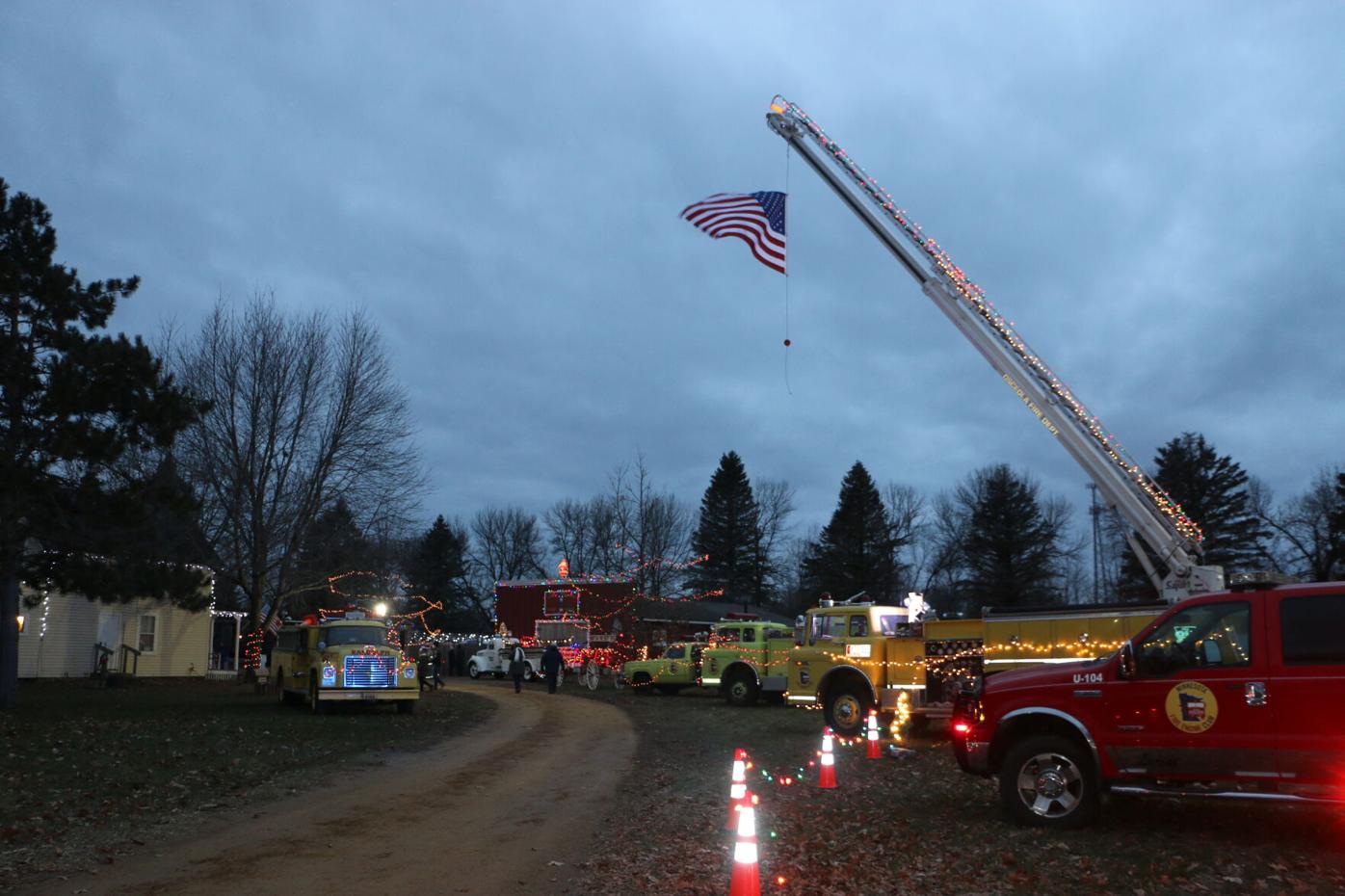 Fire trucks lit up at Christmas in the Village