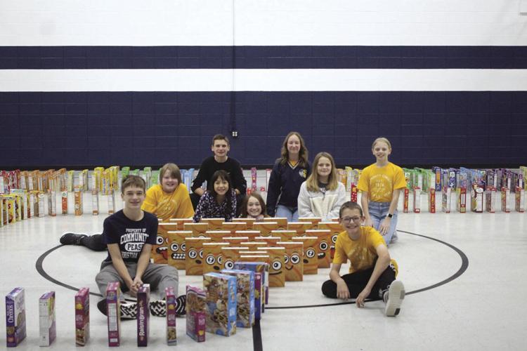 Pease CCS students celebrate donation goal with cereal dominos Free