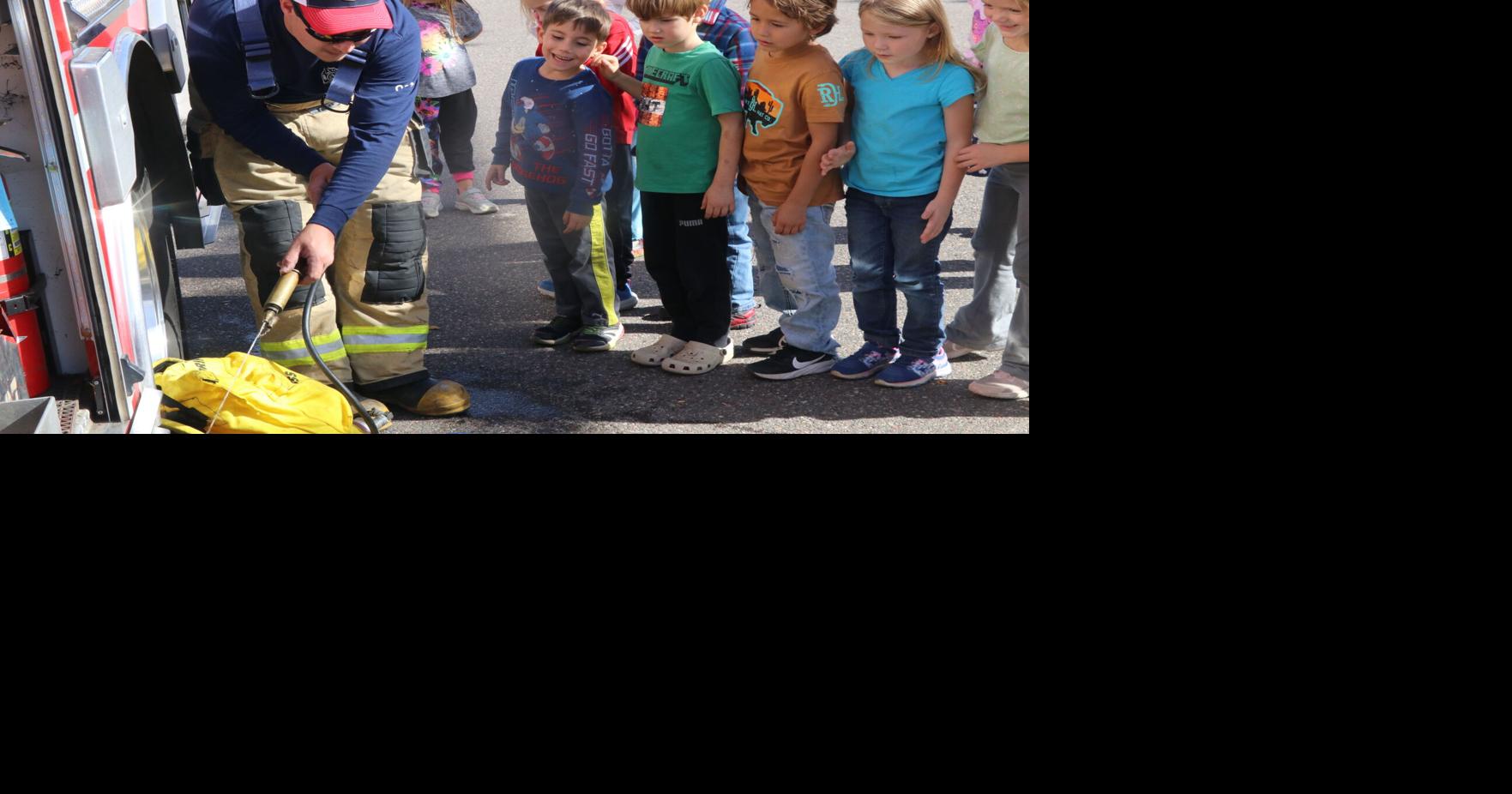 Watching a fire equipment demo Education