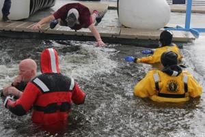 Other Text A belly flop occurs at the Anoka County Polar Plunge at Lakeside Commons Park on Saturday, Feb. 28. In cloudy conditions and temperatures in the 20s, many members of the community, as well as organizations such as school lacrosse teams… Alt Text