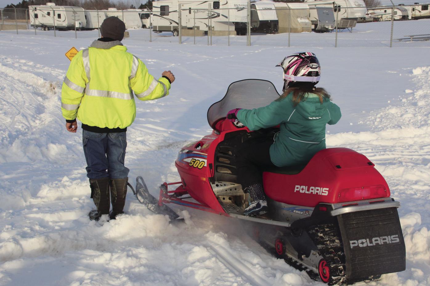 Youth participate in snowmobile training course Free