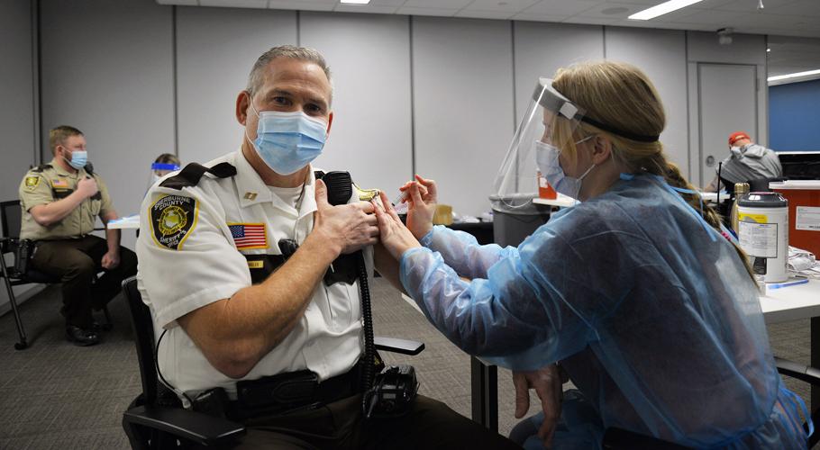 With delivery of 200 doses of vaccine, Sherburne gives shots to police