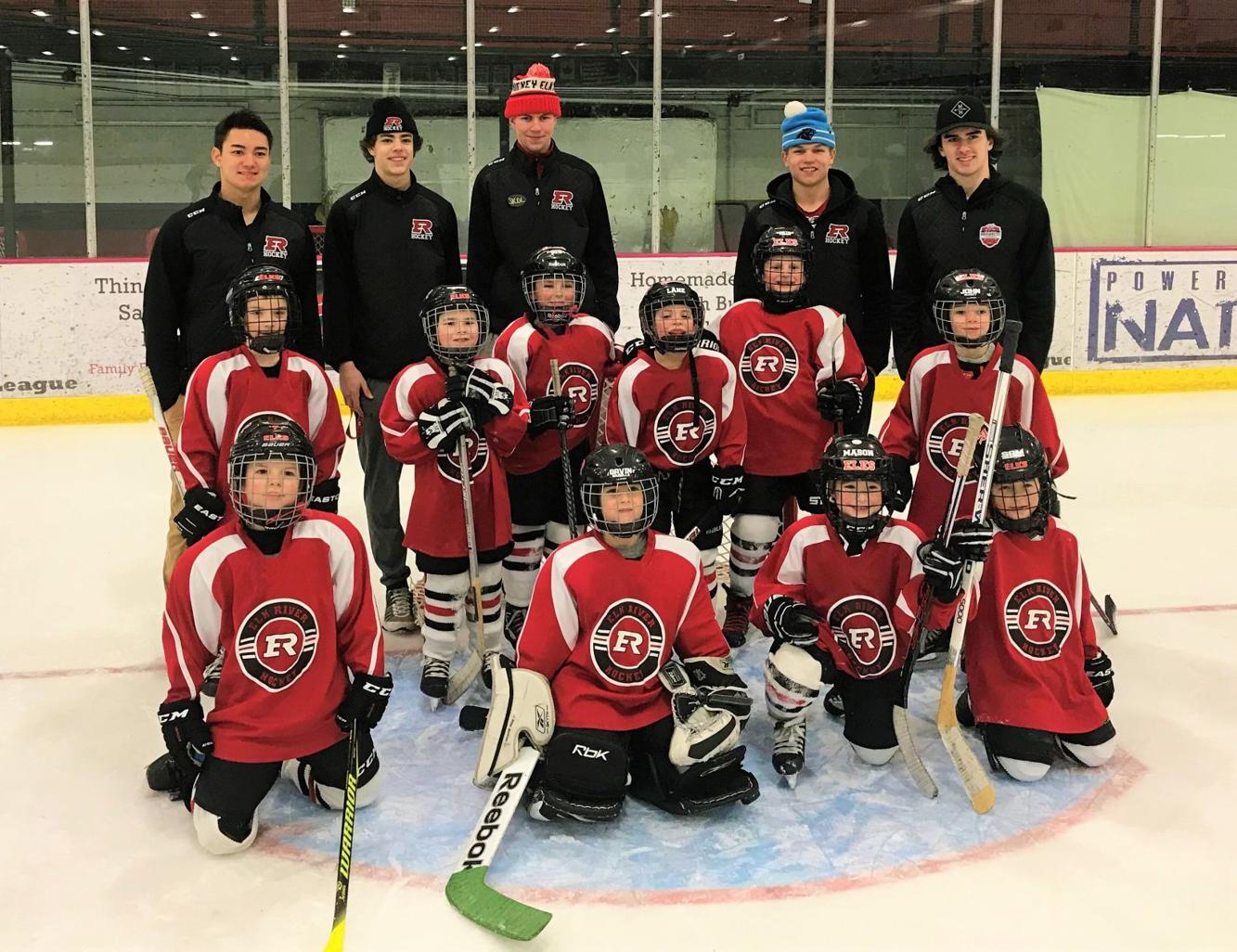 Elk hockey players make special appearance at Mite hockey game Elk