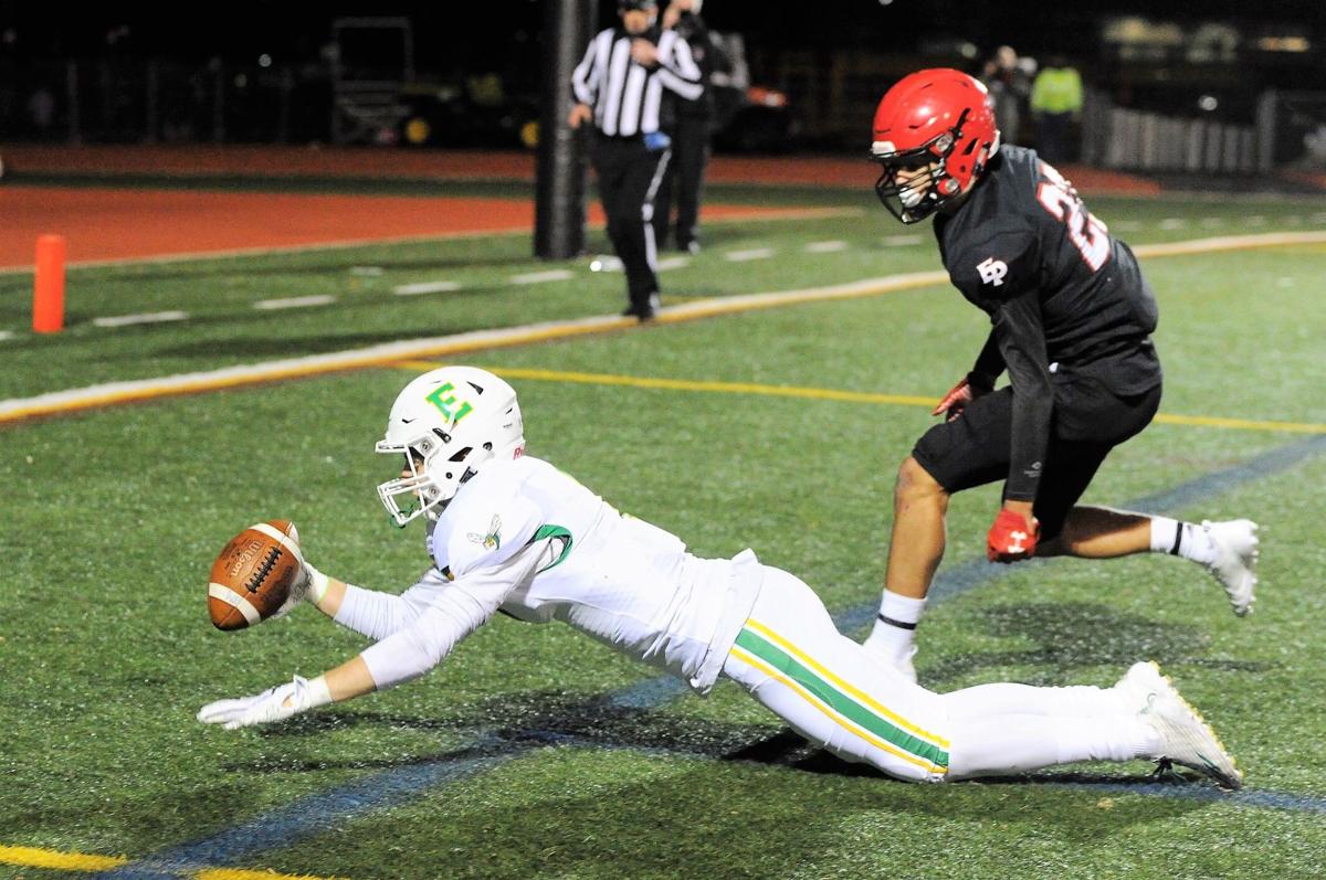 Edina receiver Jake Boltmann (7) almost comes up with a spectacular catch  in the end zone during the Hornets' 21-0 West District football loss to Eden  ...
