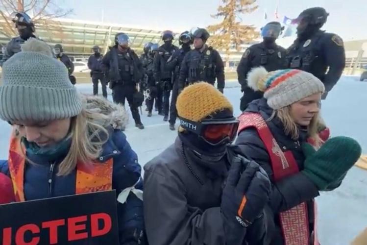 Faith leader peacefully protests ICE, supports immigrant communities ...
