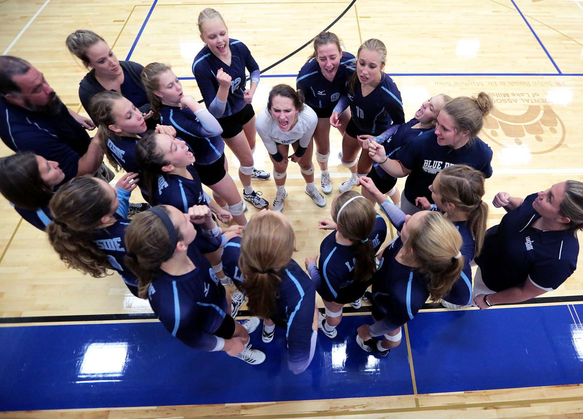 Prep girls volleyball photo: Lakeside Lutheran girls huddle up during a match