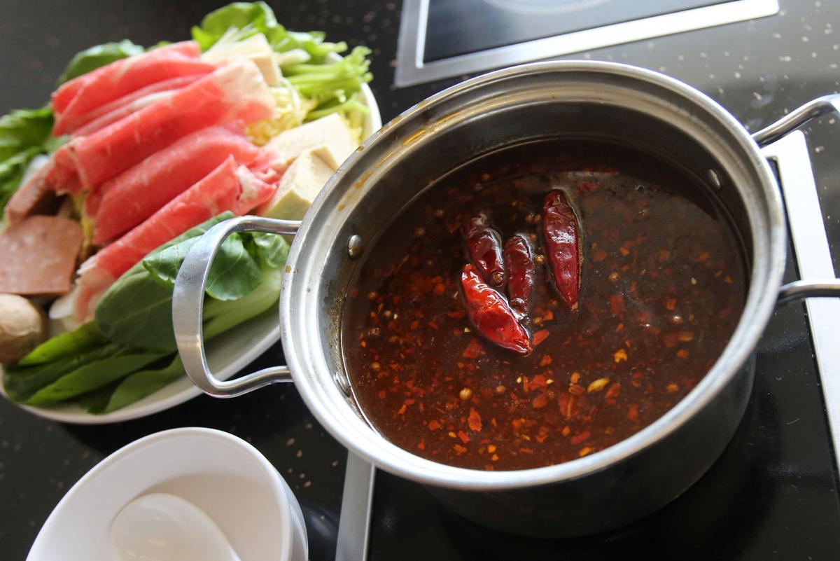 Let's Eat Warm up with savory, soothing broth at Mini Hot Pot on Park