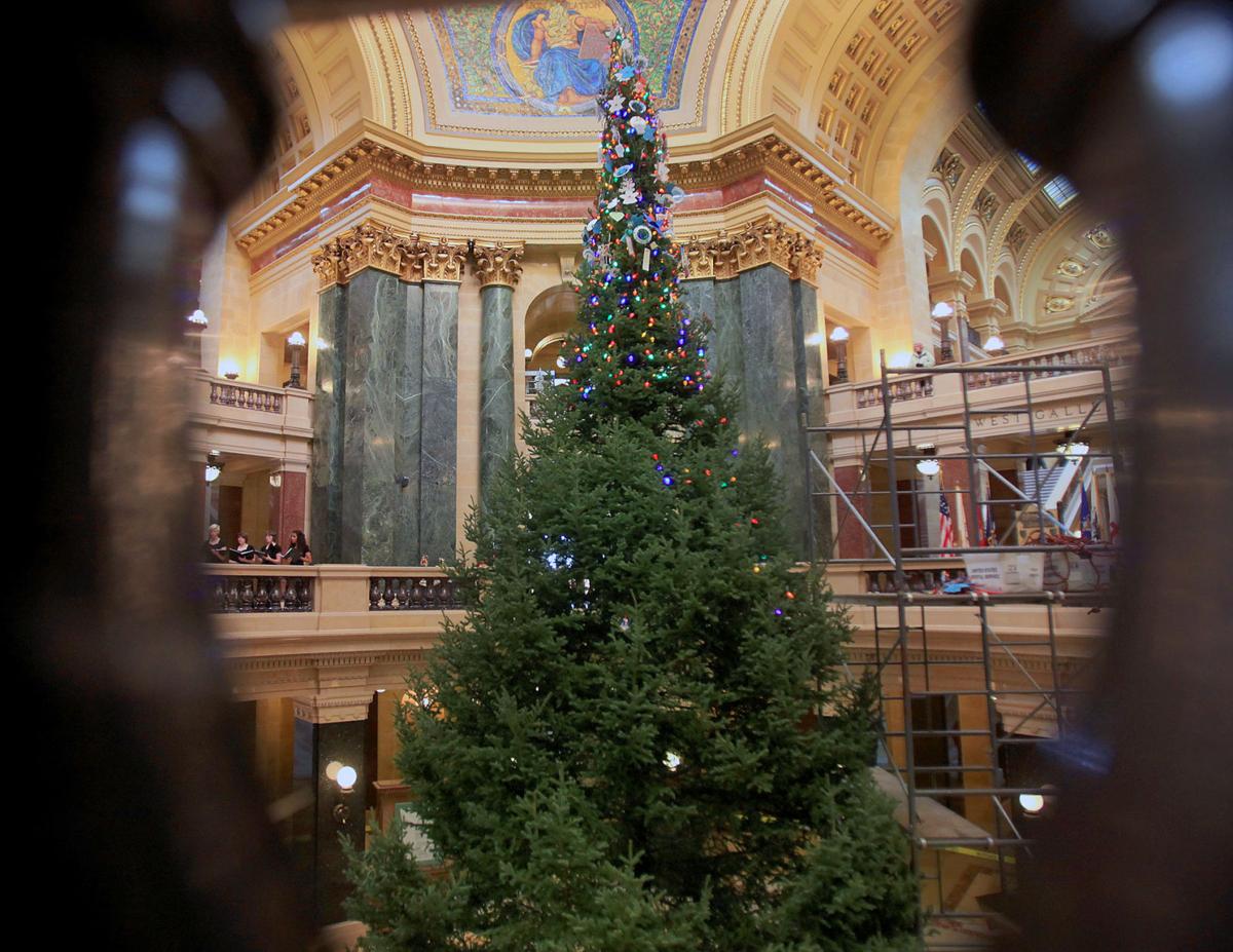 Photos Decorating the State Capitol Christmas tree Local News host