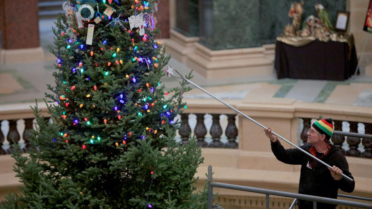 Photos Decorating the State Capitol Christmas tree Local News host