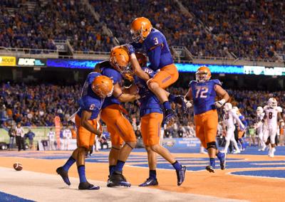 football boise state quotes idahopress idaho celebrating touchdown huff quarterback holden stuart jumps pass thomas college while