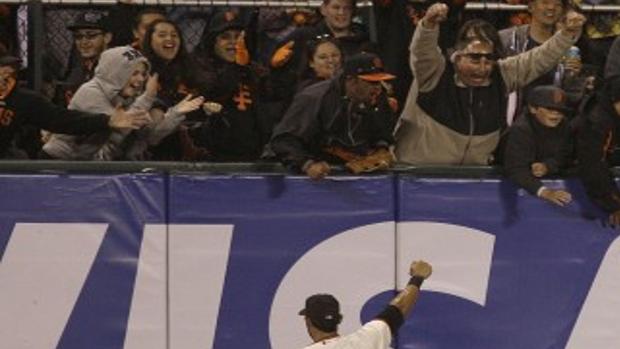 San Francisco Giants pitcher Matt Cain, right, joined by his wife, Chelsea,  and their daughter, Harley Mae, pose for a photo next to a plaque  commemorating his perfect game in June, before