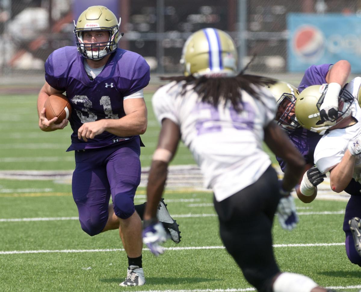 Yotes football team competes in open scrimmage for fans | Members ...