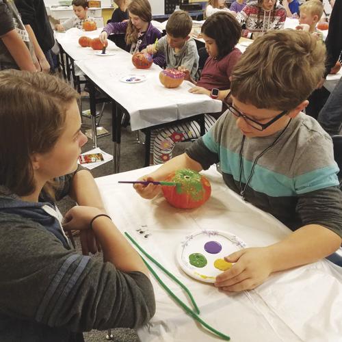 Kuna FFA members teach Reed Elementary students where their food comes