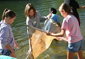 Students step into the Boise River for hands-on science