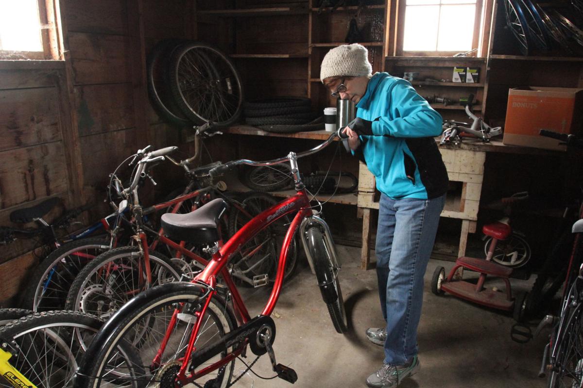 Volunteers repair donated bikes for adults in need of transportation