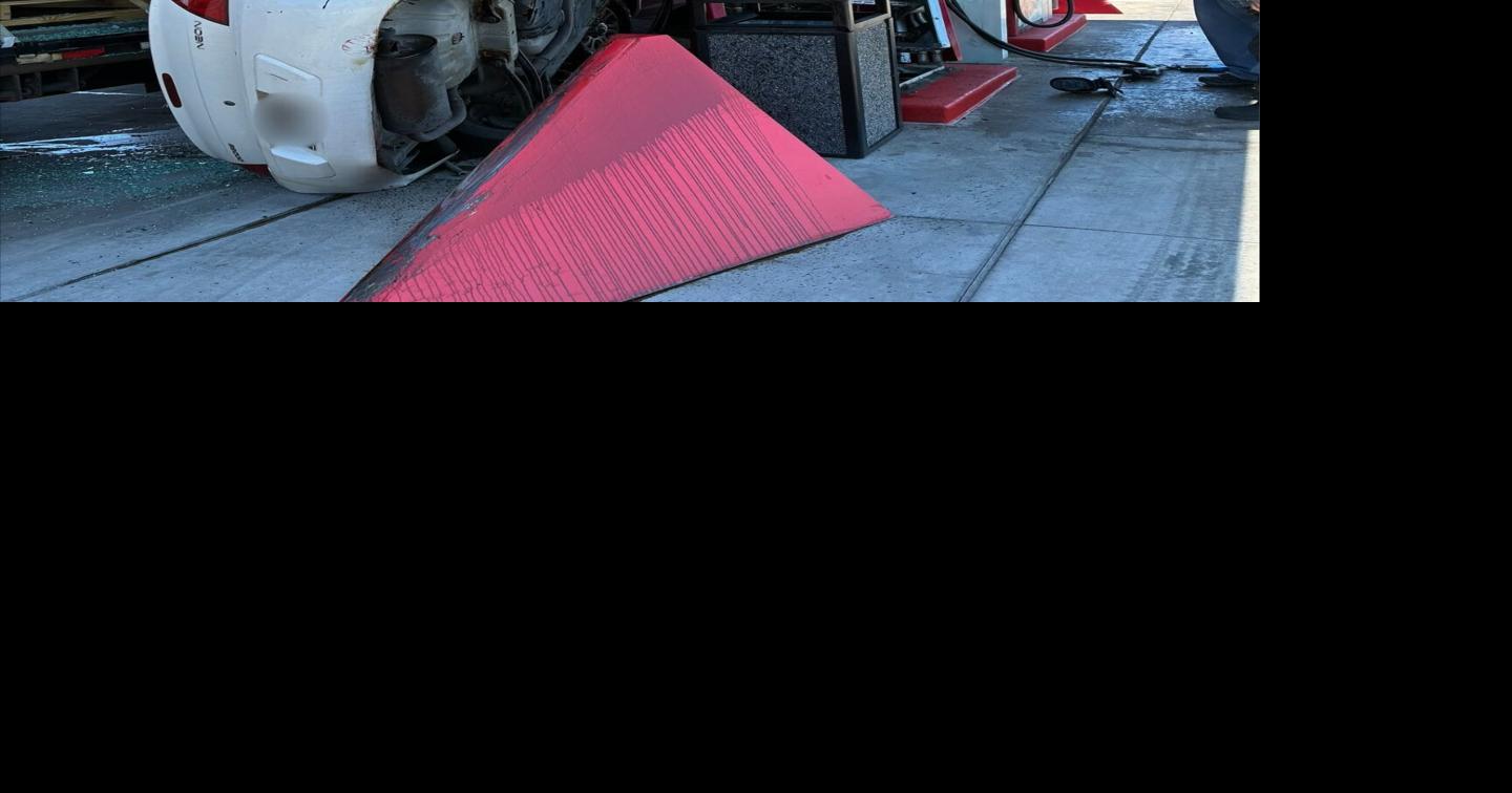 Gas station crash leaves car wedged between pickup and fuel pump