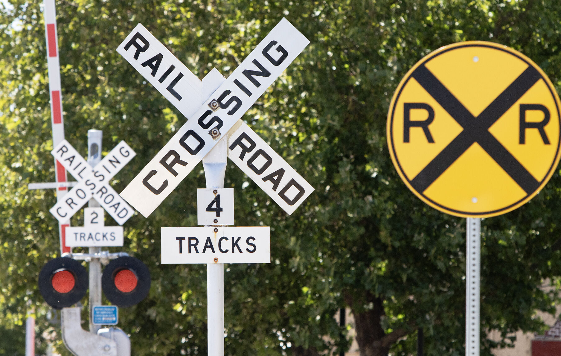 Train tracks converging, symbolizing strategic decisions for railway system stability and future planning.