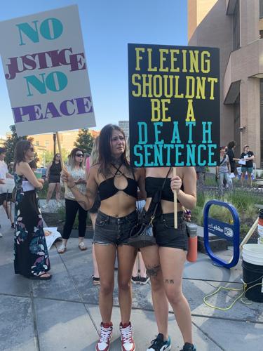 NEWS: Crowd decries violence demands accountability at rally over