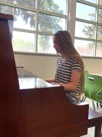 An instrument in spreading joy: Local LDS church donates new piano to Aid for Friends shelter