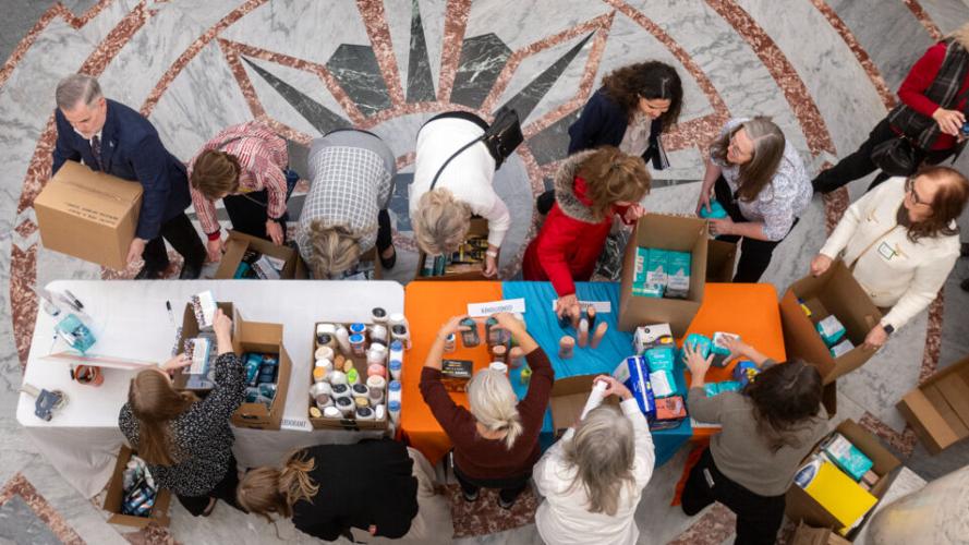 Volunteers prepare hygiene kits