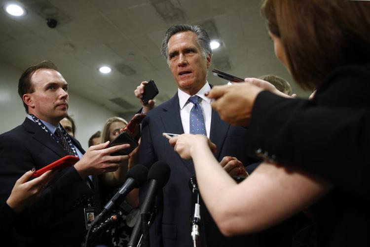 Utah Sen. Mitt Romney speaks to reporters in May
