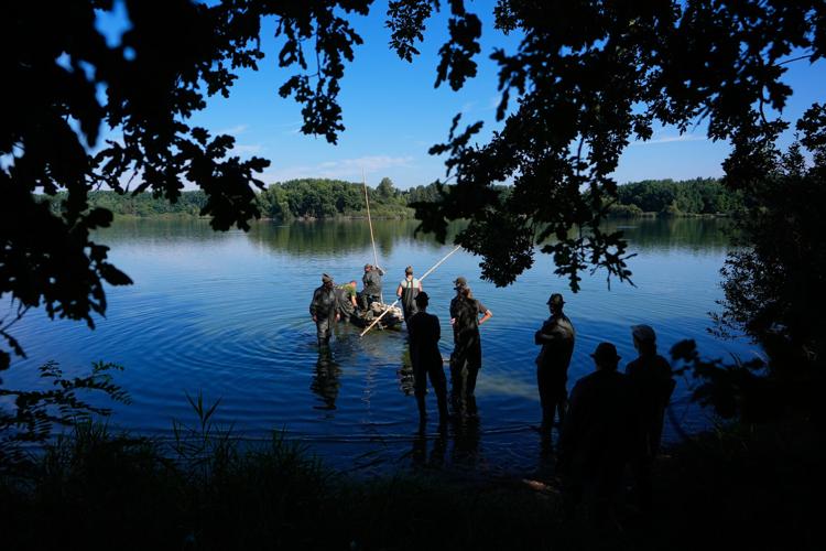 Photos show European fishers on the brink as summer drought parches rivers, lakes and farms