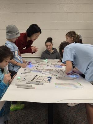 Youth enjoy learning with Ozobots at local elementary school