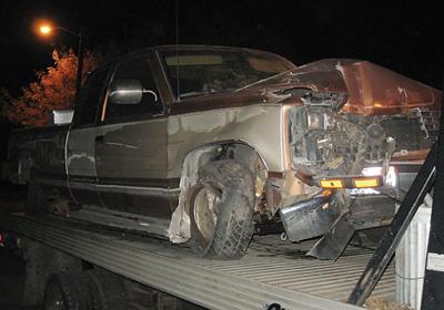 Pickup hits sign at Doc's Gun Barn