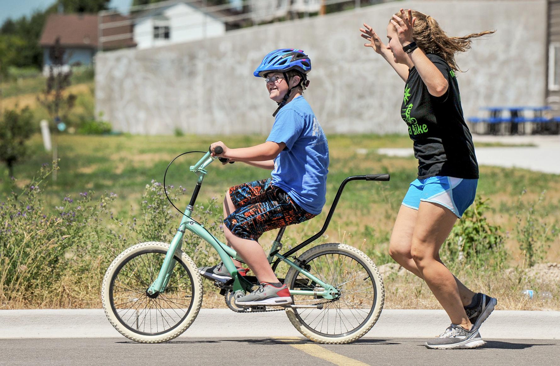 Camp teaches children with Down Syndrome to ride bike Local