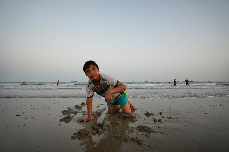 Photos show daily life in Iran on the beach along the Strait of Hormuz