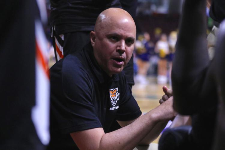Ryan Looney coaching on bench.jpg