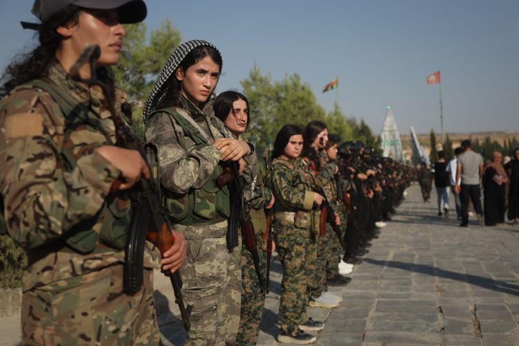Photos of the funeral for victims of a deadly prison fire and riot in northern Syria