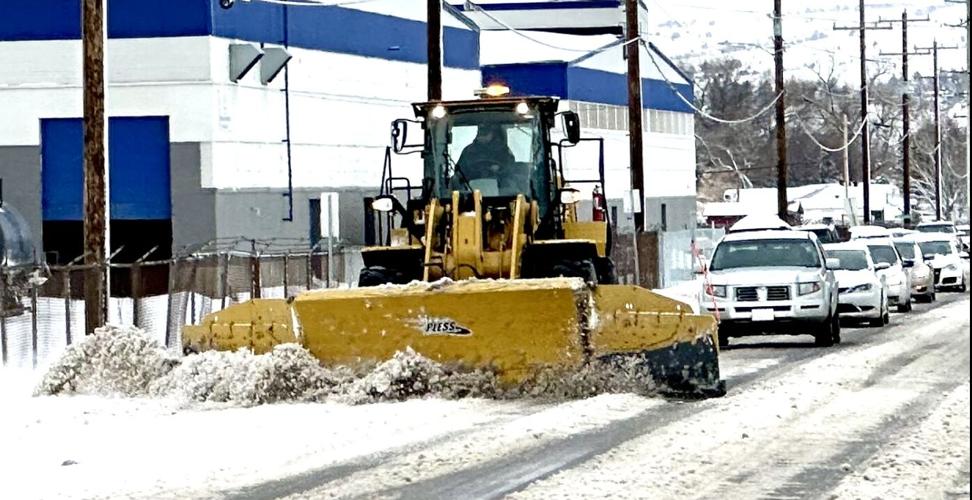 Snowplow removing snow from Pole Line