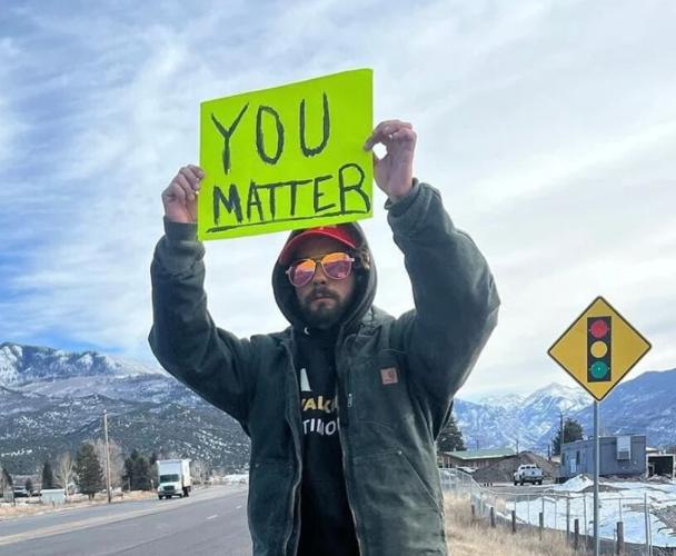 Kyndal Ray holding sign