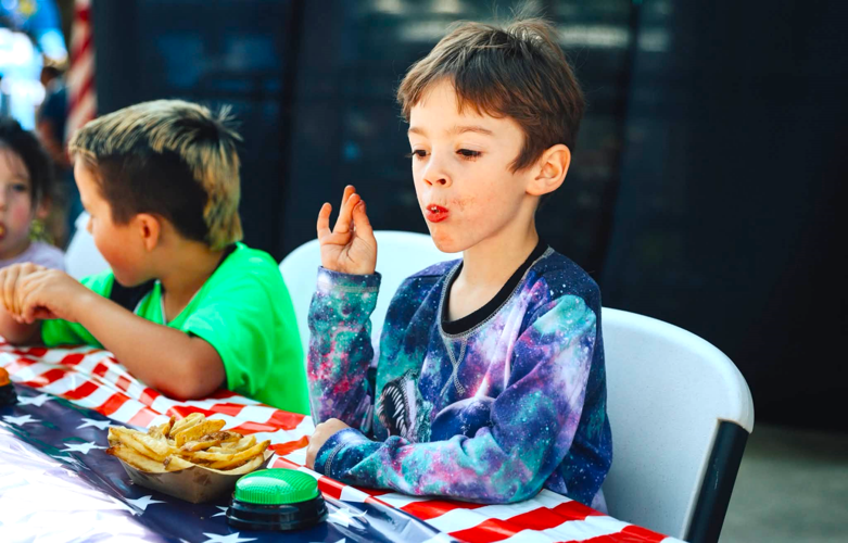 young boy fry eating contest.png