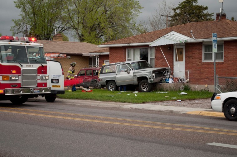 SUV vs. house Seizure apparently caused accident here Local