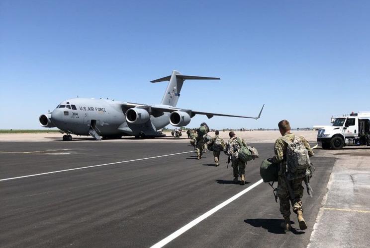 Idaho National Guard 116th walking to plane for D.C. deployment