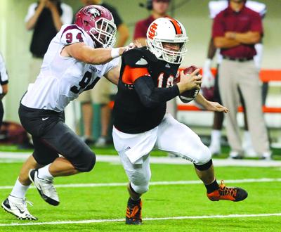 football idaho justin isu idahostatejournal state chadron collin grasp quarterback eisenman arias scrambles avoid right game