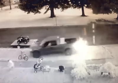 Screenshot of video showing truck trying to run over child on bicycle