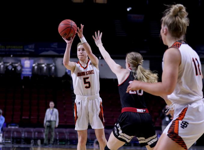 Dora Goles launches from three with foreground.jpg