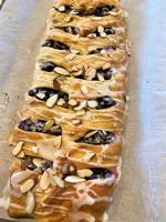 Fresh berries and cream cheese in a fancy, flakey pastry
