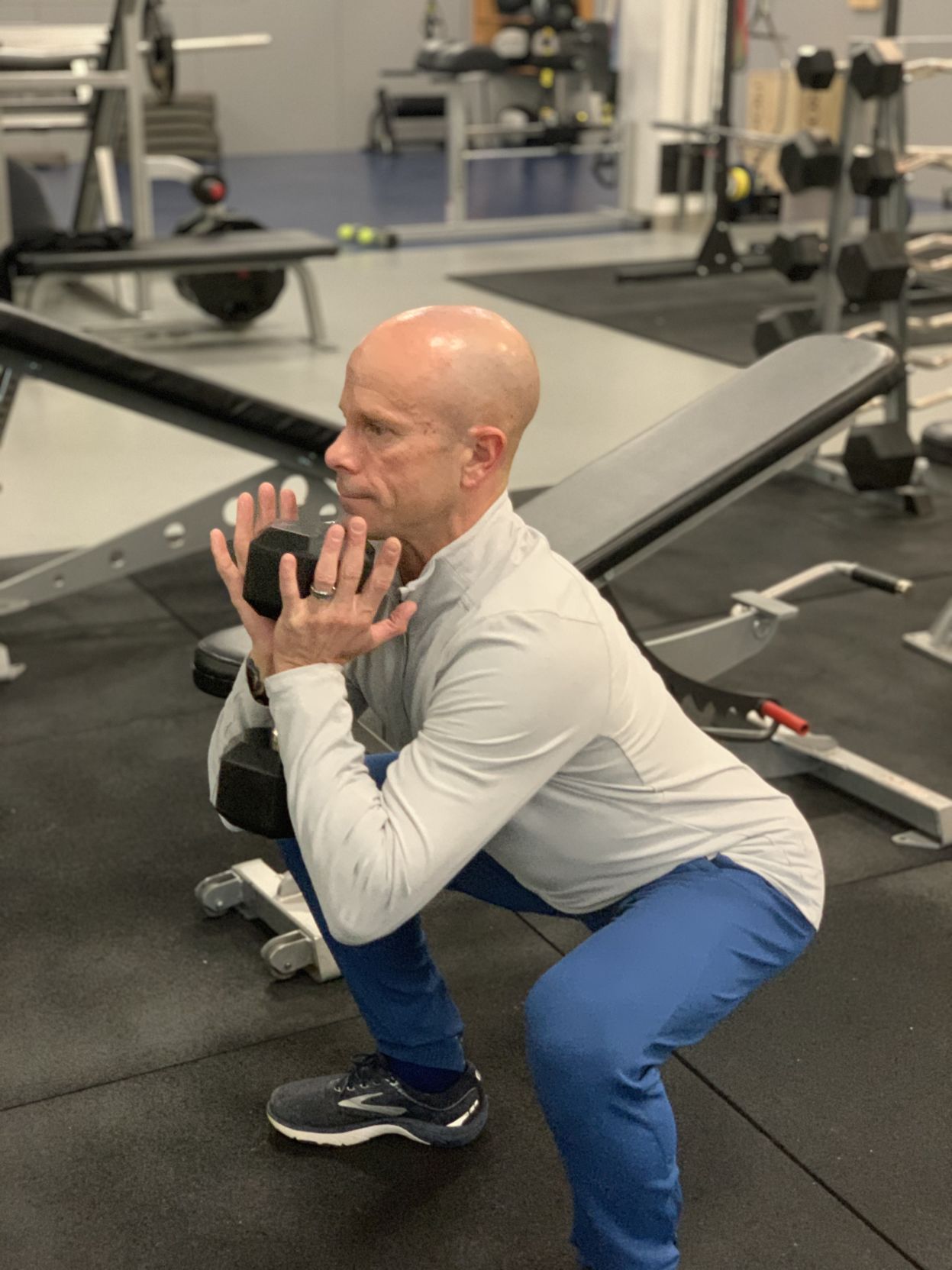 Brad Mitchell demonstrates a squat.jpg